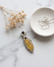 Load image into Gallery viewer, handcrafted golden bumblebee jasper pendant with soft yellow tones sterling silver wire wrap with scroll detail and gemstone accents