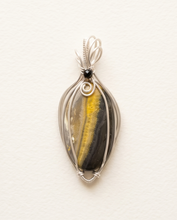 Load image into Gallery viewer, Handcrafted bumblebee jasper pendant in sterling silver with vertical yellow band and minimalist wire wrap design