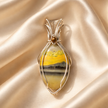 Load image into Gallery viewer, Handcrafted bumblebee jasper pendant in sterling silver with soft yellow and gray banding and elegant wire wrap design