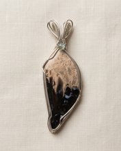 Load image into Gallery viewer, Heart shaped Palm Root stone pendant set in sterling silver featuring natural fossilized patterns.