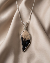 Load image into Gallery viewer, Heart shaped Palm Root stone pendant set in sterling silver featuring natural fossilized patterns.