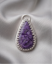 Load image into Gallery viewer, Purple Charoite pendant set in handcrafted sterling silver with decorative edging.
