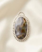 Load image into Gallery viewer, Oval scenic agate pendant with natural landscape pattern set in sterling silver.