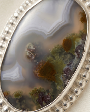 Load image into Gallery viewer, Oval scenic agate pendant with natural landscape pattern set in sterling silver.