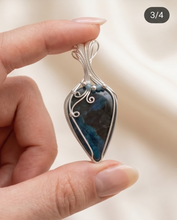 Load image into Gallery viewer, Handcrafted sterling silver Shattuckite pendant featuring deep blue and teal natural patterns with artisan wire work.
