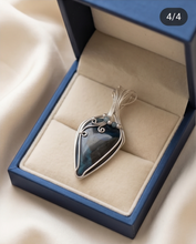 Load image into Gallery viewer, Handcrafted sterling silver Shattuckite pendant featuring deep blue and teal natural patterns with artisan wire work.
