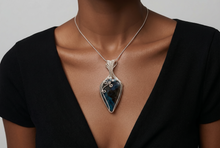 Load image into Gallery viewer, Handcrafted sterling silver Shattuckite pendant featuring deep blue and teal natural patterns with artisan wire work.
