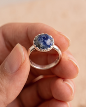 Load image into Gallery viewer, Handcrafted sterling silver ring featuring a 10 mm blue and white Sodalite gemstone