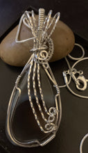 Load image into Gallery viewer, a couple of pairs of scissors sitting on a table 